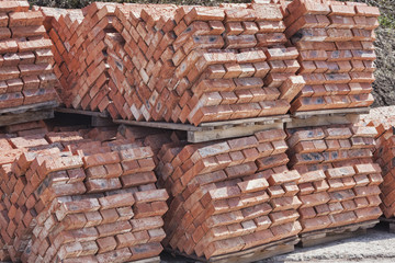 A pile of new red bricks