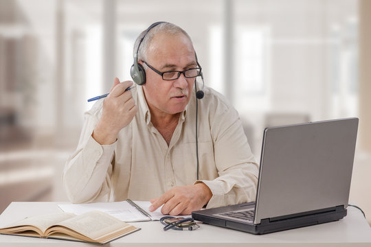 Freelance male tutor working online