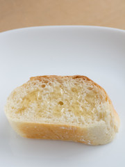 Piece of french bread with honey