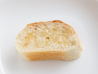 Piece of french bread with honey