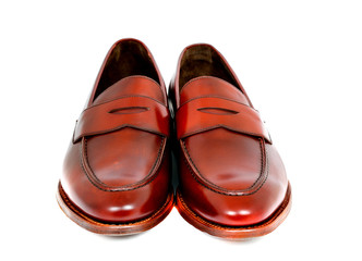 Obraz na płótnie Canvas Pair of leather cherry calf penny loafer shoes together one by one closely