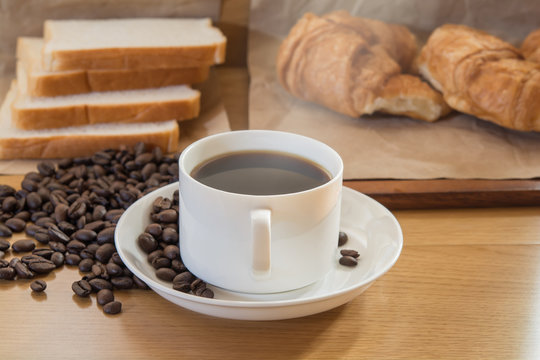 coffee and bread in the morning on food table
