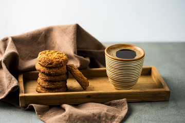 Closeup of chocolate cookies and a cup of coffee