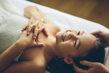 doctor massaging or doing gymnastics baby girl