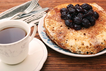 Delicious pancakes with cherry jam