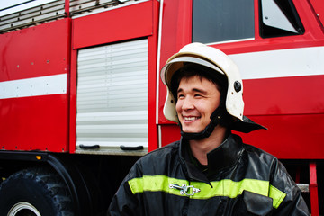 Obraz premium Portrait of a man, a firefighter, an Asian-Kazakh at work