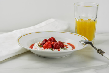 cottage cheese with strawberry sauce and fresh berries