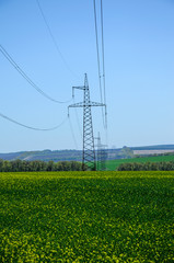 High voltage power line against sky
