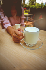 Warm milk in a cup with a cozy atmosphere on holiday