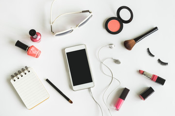 makeup cosmetics with smart phone and notepad