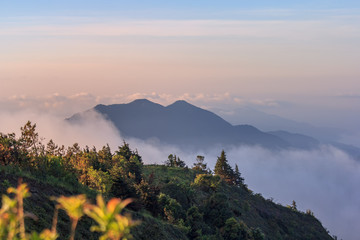 Obraz premium Beautiful Colorful Sunrise and Silhouette Mountain on the top of mountain in Thailand 
