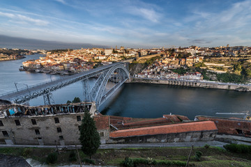 Aerial view with Dom Luis I Bridge from Vila Nova de Gaia. Porto city on background, Portugal