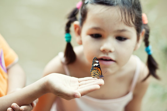 Little girl with butterfly 