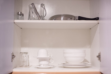 Fototapeta na wymiar Kitchen interior with knifes set, sink, pots and pans
