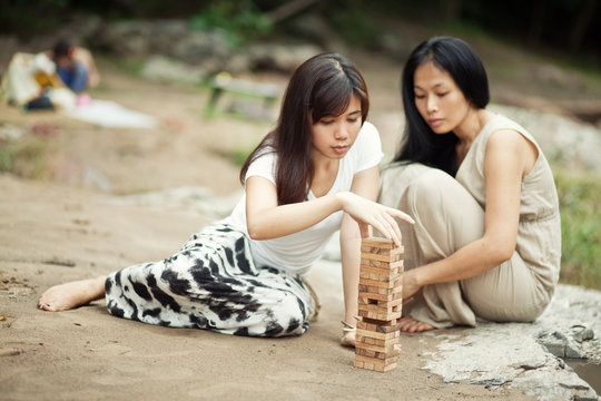 Women playing board game 