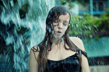 Fototapeta na wymiar Girl splashing water 
