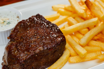 Rustic grilled beefsteak with french fries
