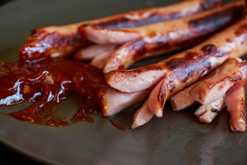 Fried sausages with ketchup