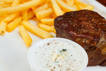 Rustic grilled beefsteak with french fries