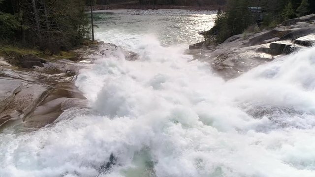 Massive Fresh White Water with Strong Current Flowing Down Waterfall in Slow Motion Drone Shot