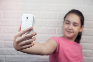 Young girl doing selfie