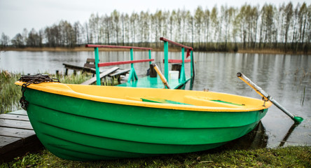 Classic boat with oars on the river.