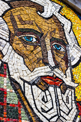 Colored walls with dark and colored stones in the form of holy man background for design