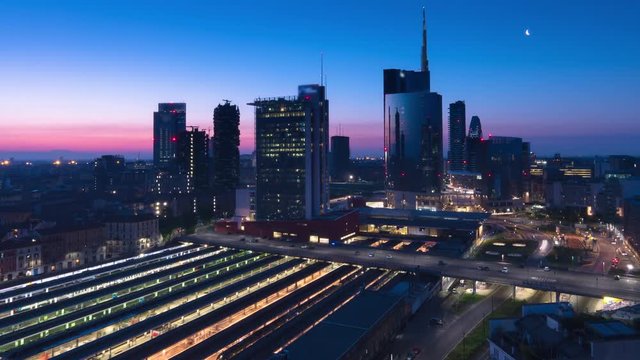 city of milan skyline time lapse from night to day pan