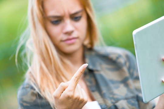 girl disgusted by something on her finger