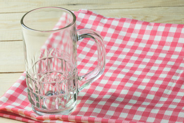 Glass on napkin cloth on tabletop