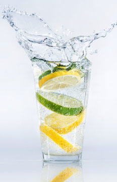 Lemons and limes in the glass. Concept and idea of drink