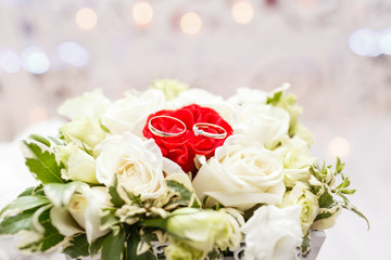 Set of wedding rings in Red and white rose taken closeup. wedding concept. selective focus