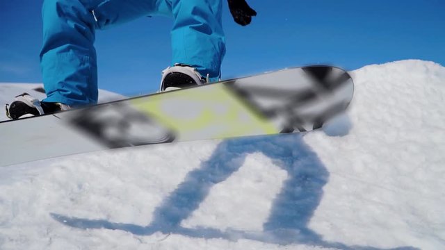 Snowboarding jumping on a kicker