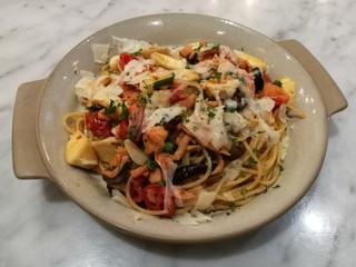 Stylist food, homemade Italian pasta spaghetti salmon garlic mushroom top with chop parsley in restaurant.healthy food.Italian food concept,focus-on-foreground with blur background, top view