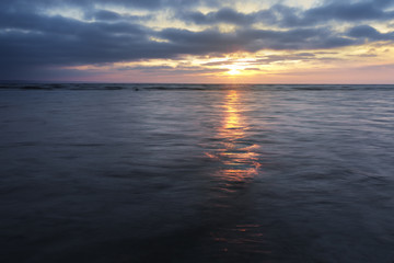 sunrise on the water / Early summer morning bright sky Beach