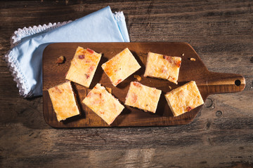 egg and bacon cubes on wooden plate 2