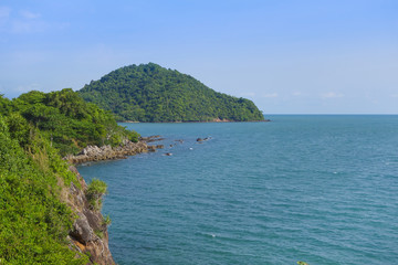 Fototapeta na wymiar Beautiful aerial view point of tropical sea bay and island, with mountain cliff and rocks in foreground, Noen Nangphaya View Point at Chalerm Burapha Chonlathit Highway, Chanthaburi, Thailand.