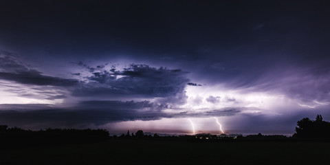 summer supercell at night with ligtning