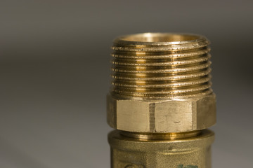 Brass adapter with threaded view.