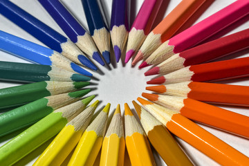 Naklejka premium colored pencils on white background