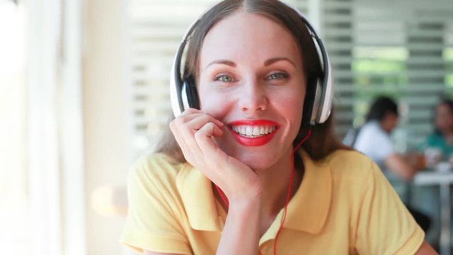 pretty female customer care representative. Woman wearing earphones