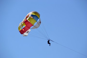 Bright parachute against the blue sky