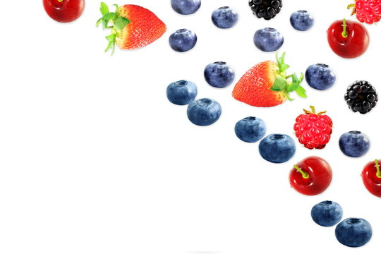 mixed fruit blueberry strawberry raspberry black berry cherry on white background with space for text