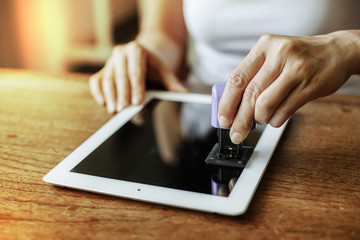 Cleaning digital tablet screen .
