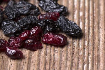 Dried Black and Red berries on wooden background