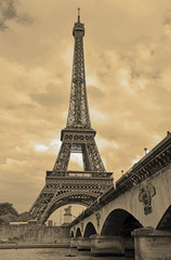 While French elections are making headlines, Eiffel Tower remains popular as ever with tourists, Paris France. Sepia filter - 149253565