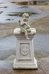 little angle doll in the garden