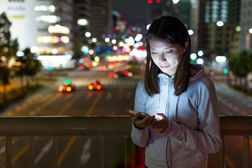 Young Woman using mobile phone in Nagoya city