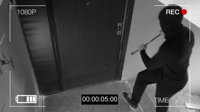 See CCTV as a burglar breaking in through the door with a crowbar.