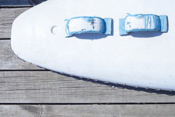 part of white Board on the background of old wood